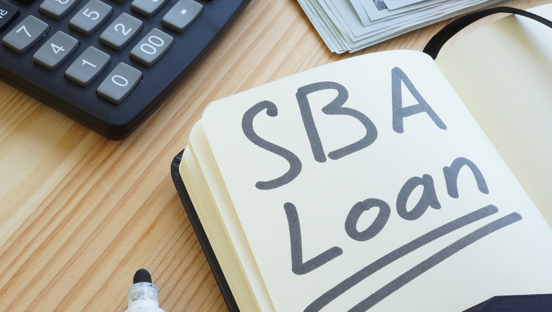 sba loan written on a piece of paper